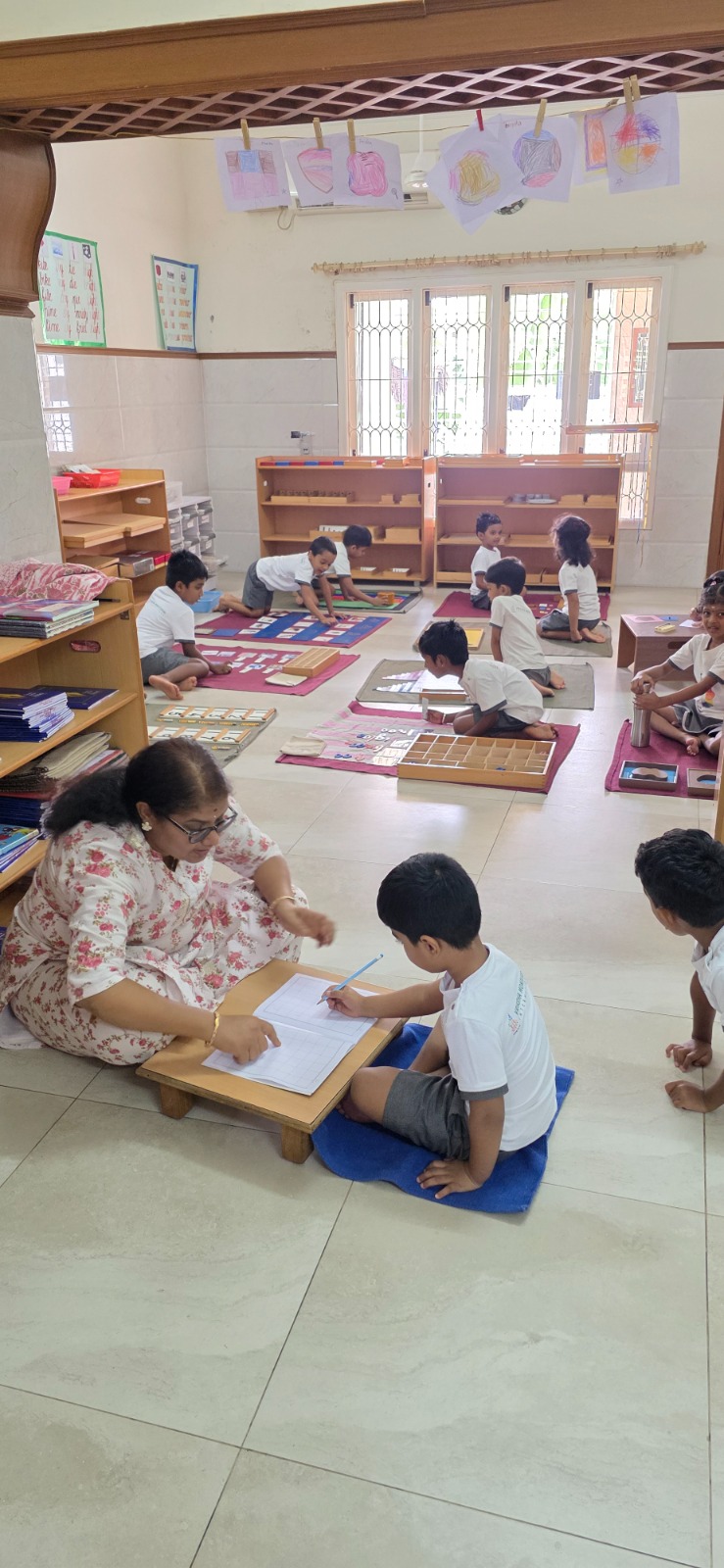 Founder Mrs. Hemamalini guiding a child